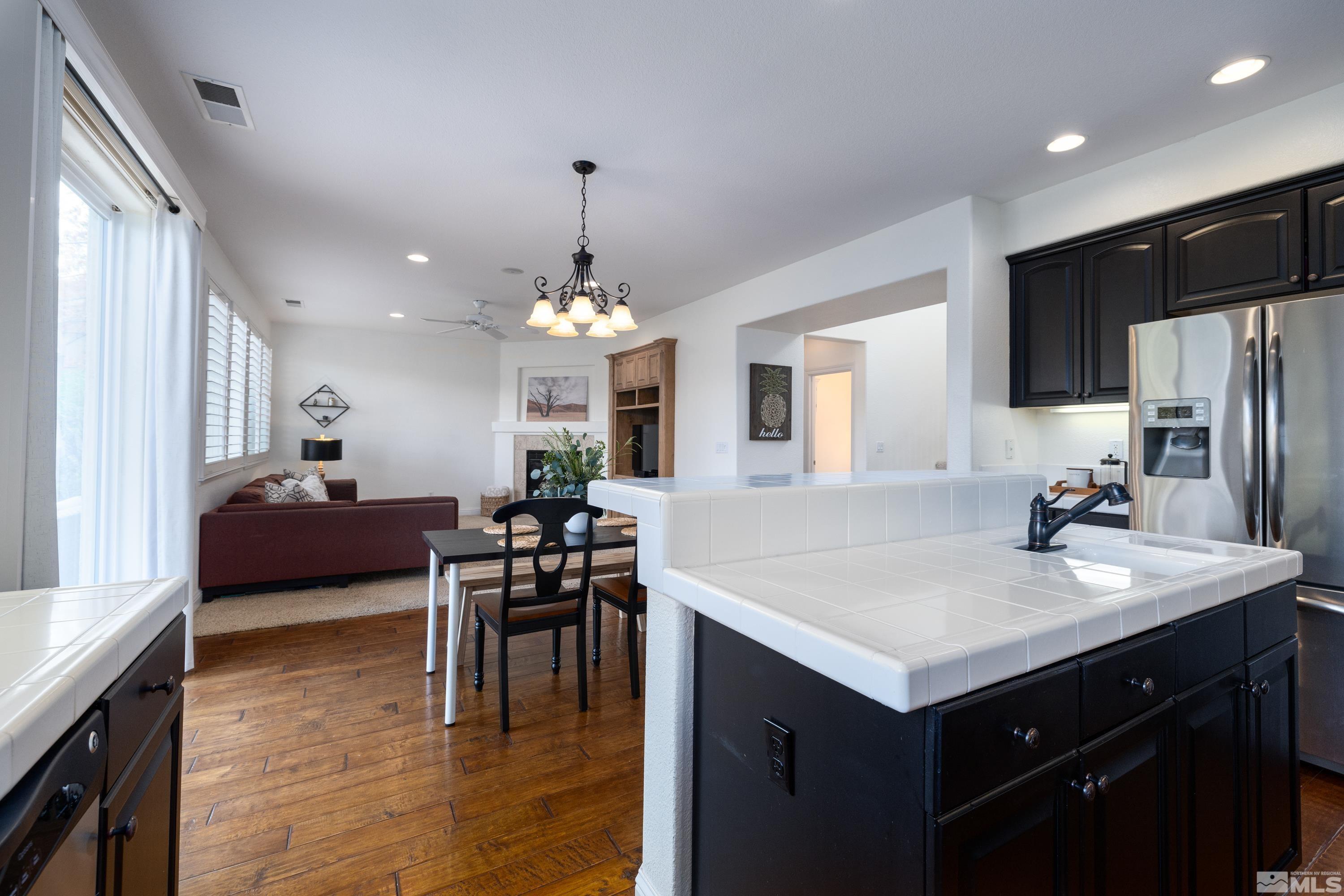 2585 Baton Drive Reno, NV 89521 - Photo 8 of 28 a kitchen with sink cabinets and wooden floor