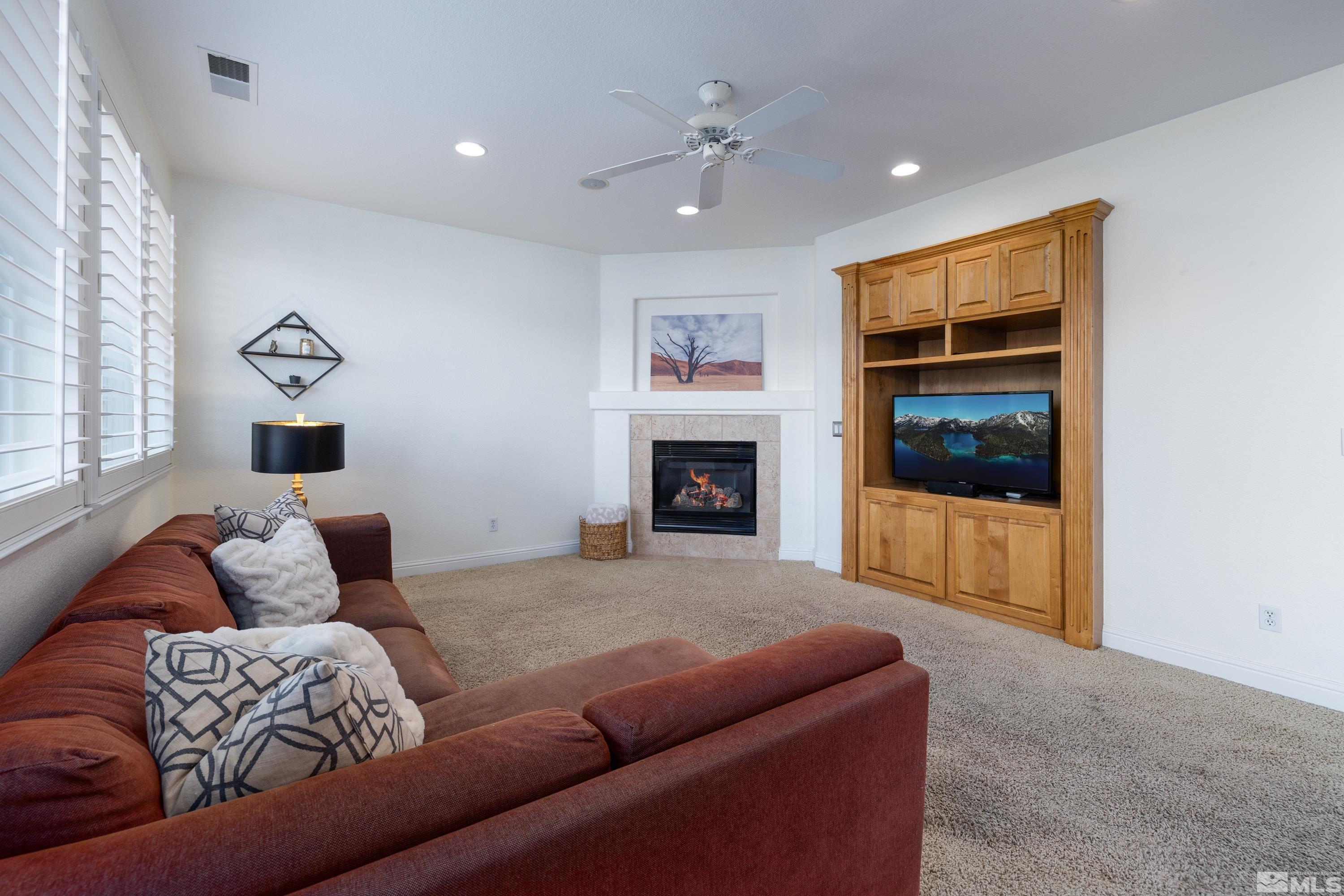 2585 Baton Drive Reno, NV 89521 - Photo 10 of 28 a living room with furniture and a fireplace