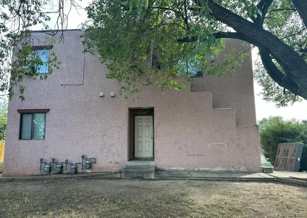 a house with trees in front of it