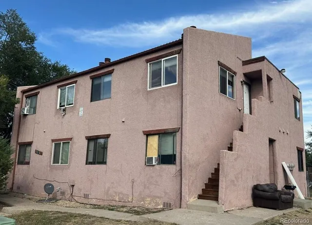 a front view of a house with many windows