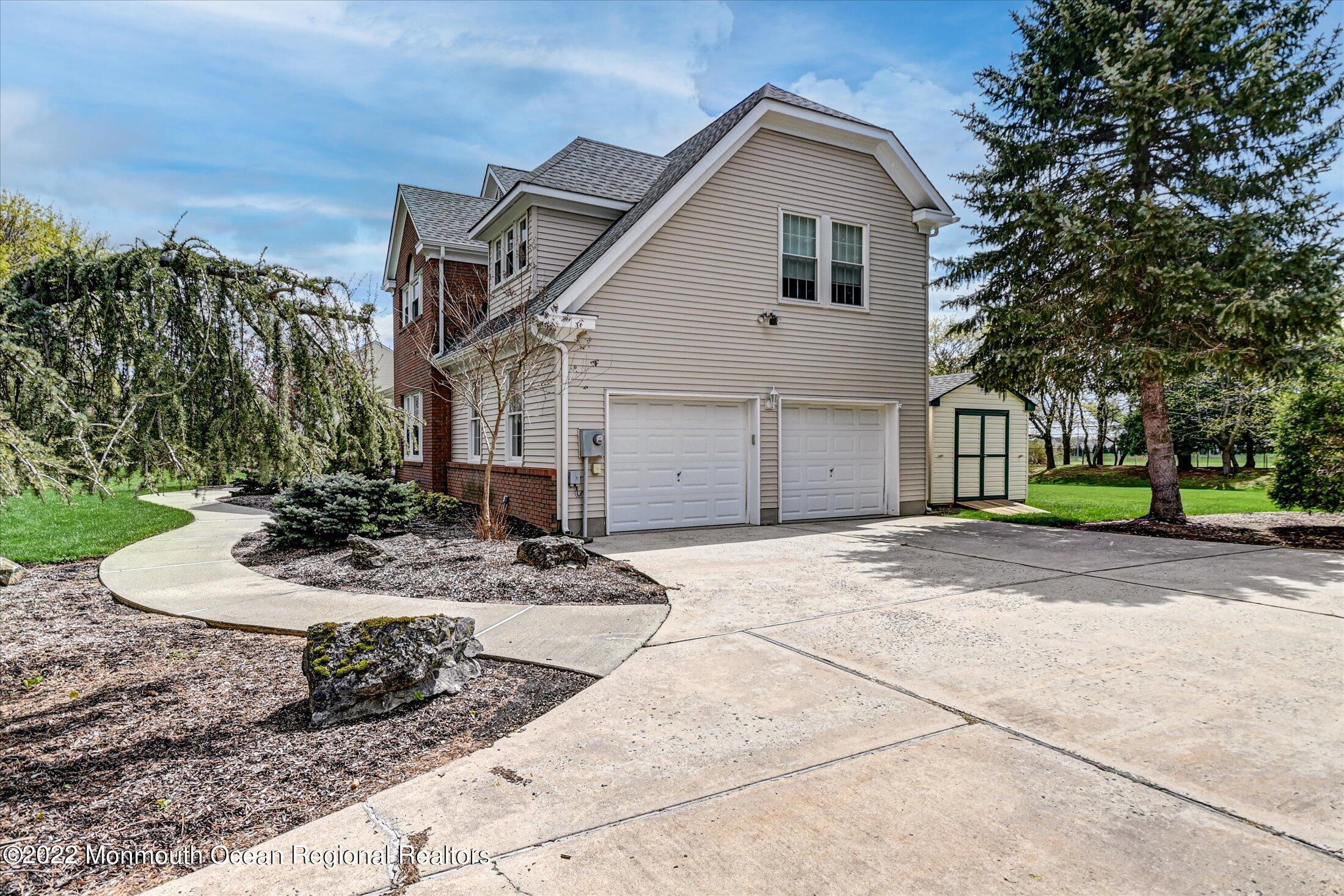 6 Falcon Ridge Circle Holmdel, NJ 07733 - Photo 6 of 43 06-Side Yard_Garages