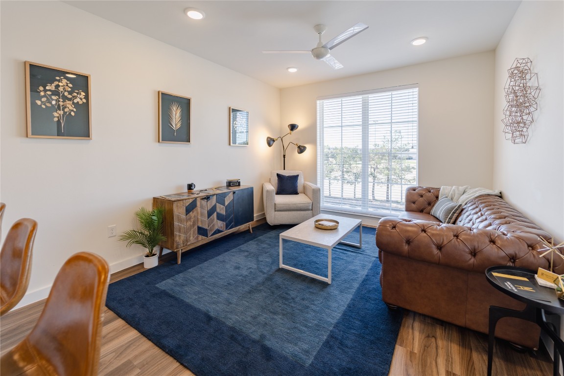 604 East Highland Mall Boulevard, Unit 418302 Austin, TX 78752 - Photo 7 of 10 a living room with furniture and a large window