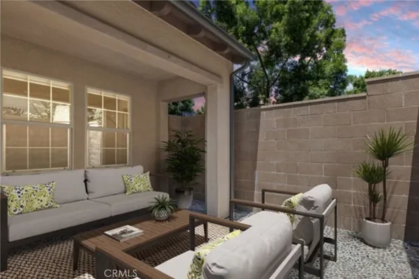 a outdoor living space with furniture and potted plants