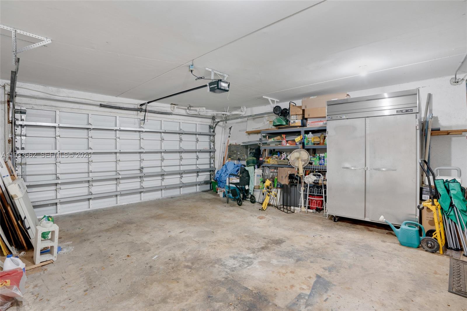 8531 Franjo Road Cutler Bay, FL 33189 - Photo 35 of 44 a view of a garage with rack and bicycle