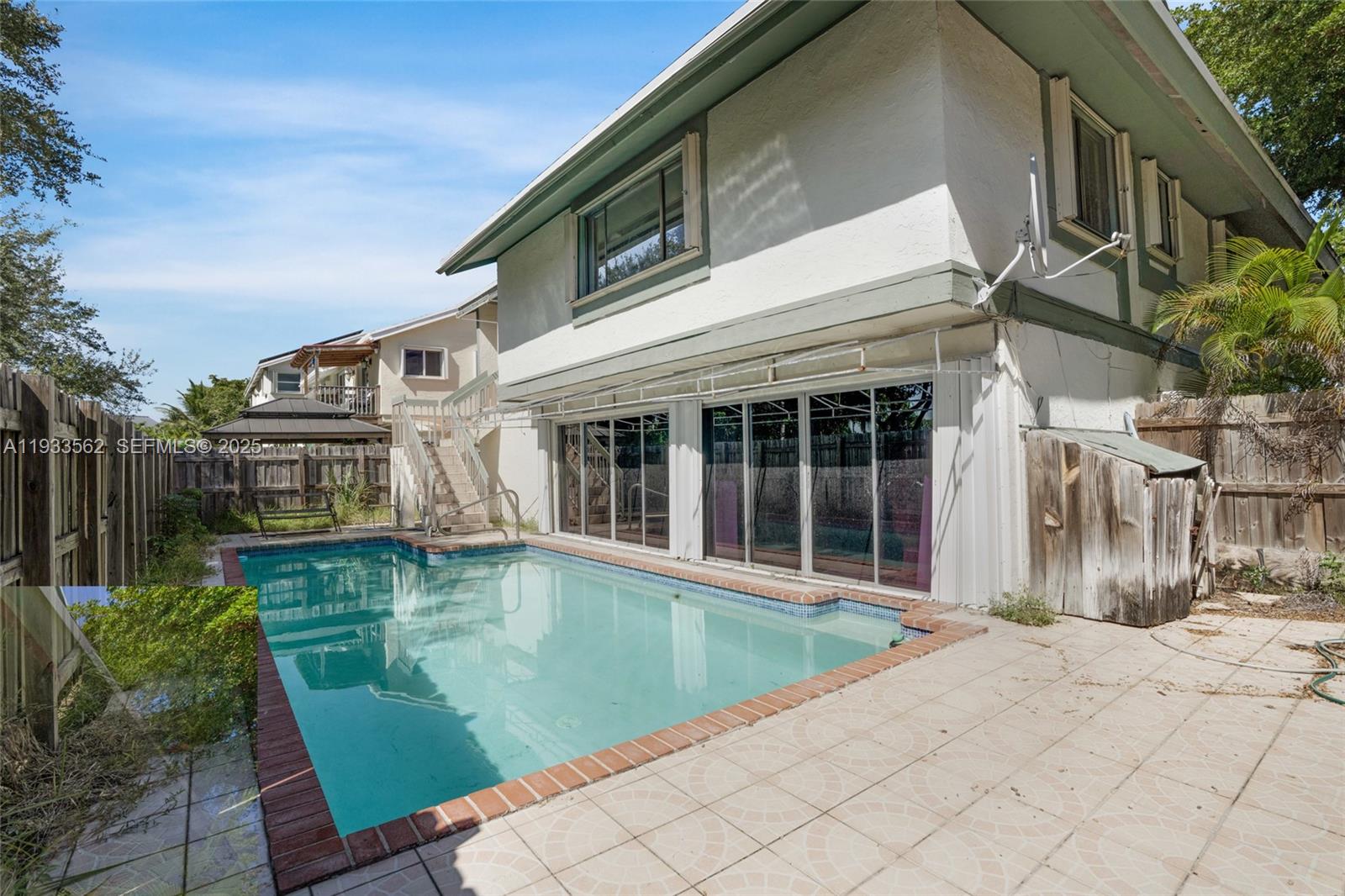 8531 Franjo Road Cutler Bay, FL 33189 - Photo 37 of 44 a view of a house with a swimming pool