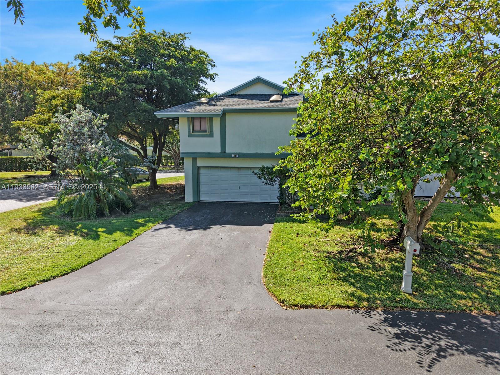 8531 Franjo Road Cutler Bay, FL 33189 - Photo 39 of 44 a front view of a house with a garden