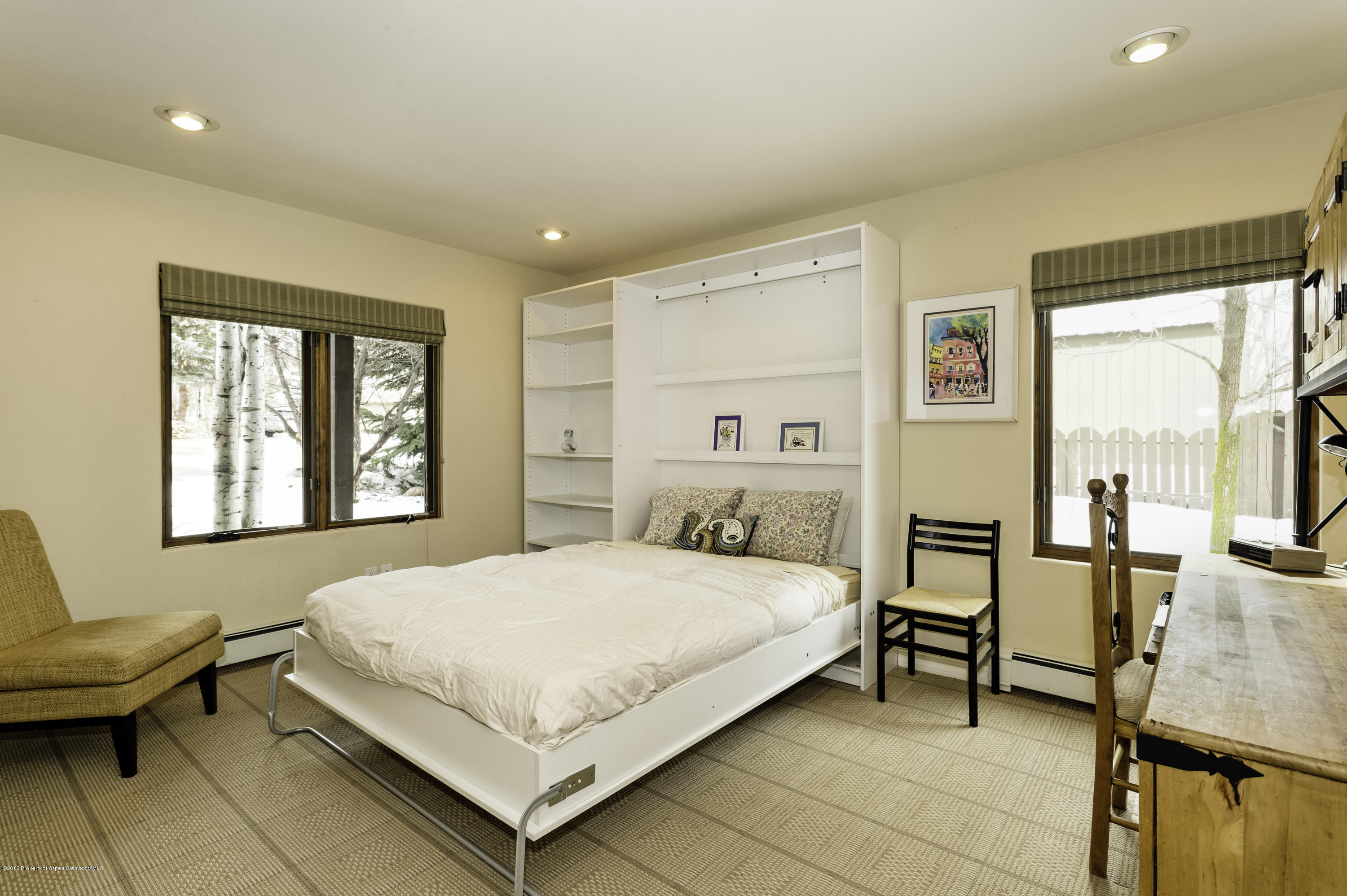 808 Kestrel Court Basalt, CO 81621 - Photo 18 of 22 a bedroom with a bed and a couch