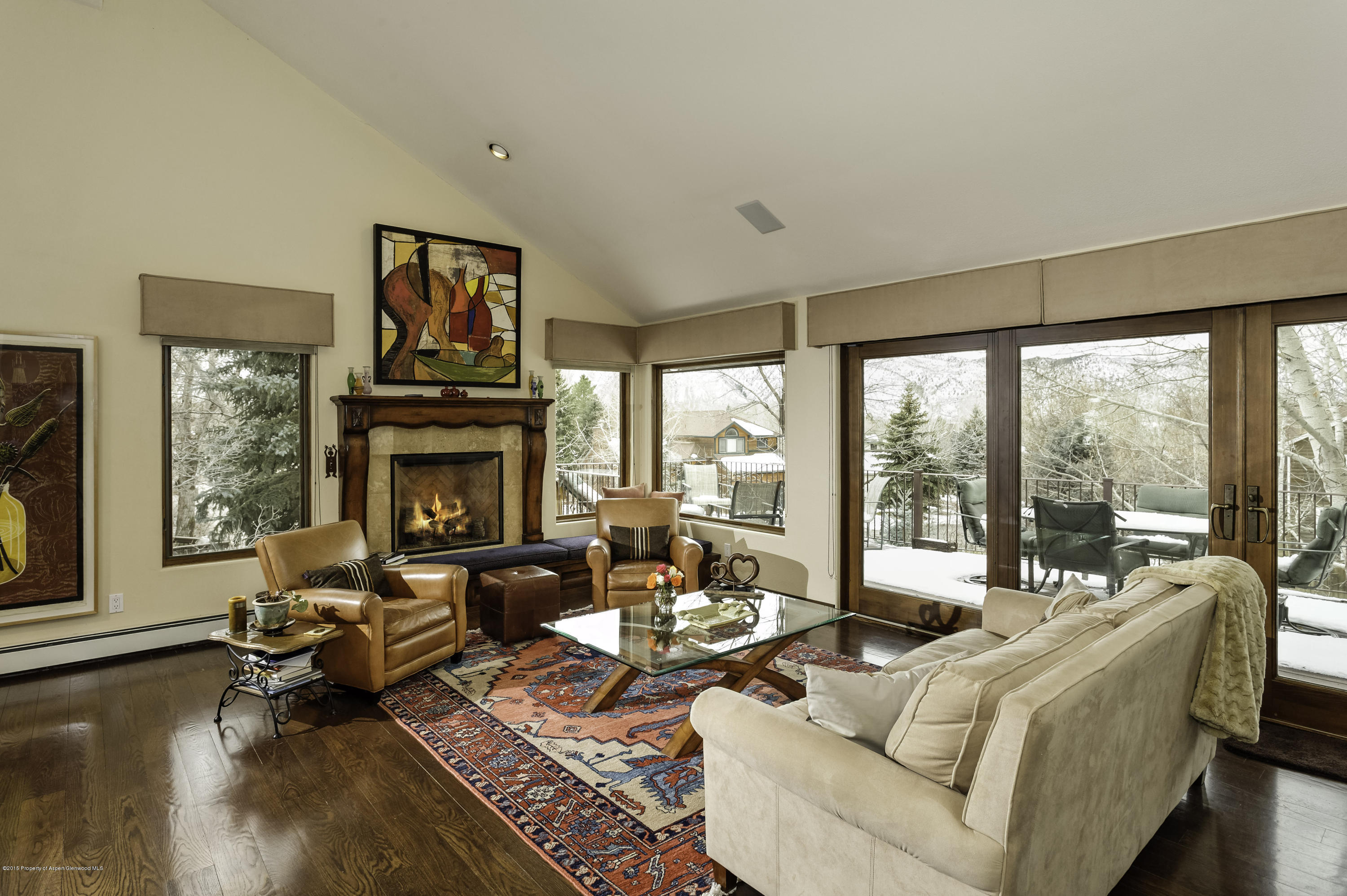 808 Kestrel Court Basalt, CO 81621 - Photo 2 of 22 a living room with furniture fireplace and a large window