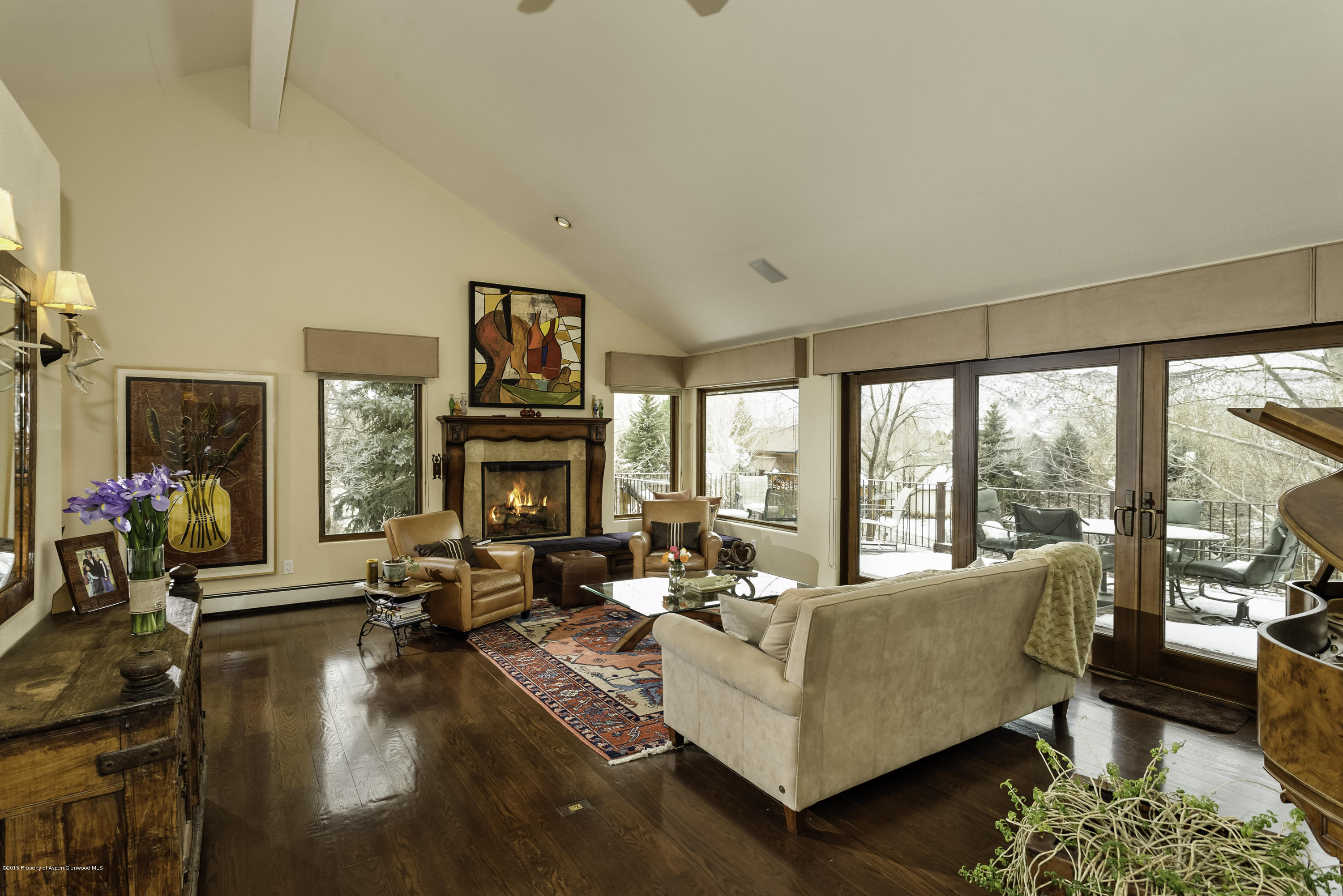 808 Kestrel Court Basalt, CO 81621 - Photo 3 of 22 a living room with fireplace furniture large window and couch