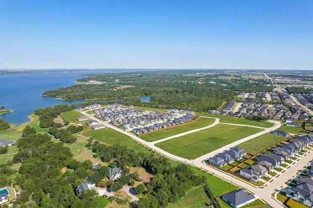 an aerial view of a residential houses with outdoor space