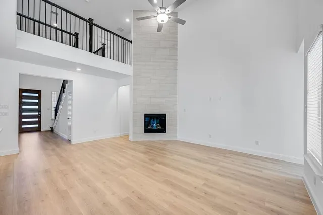 a view of an empty room with a fireplace