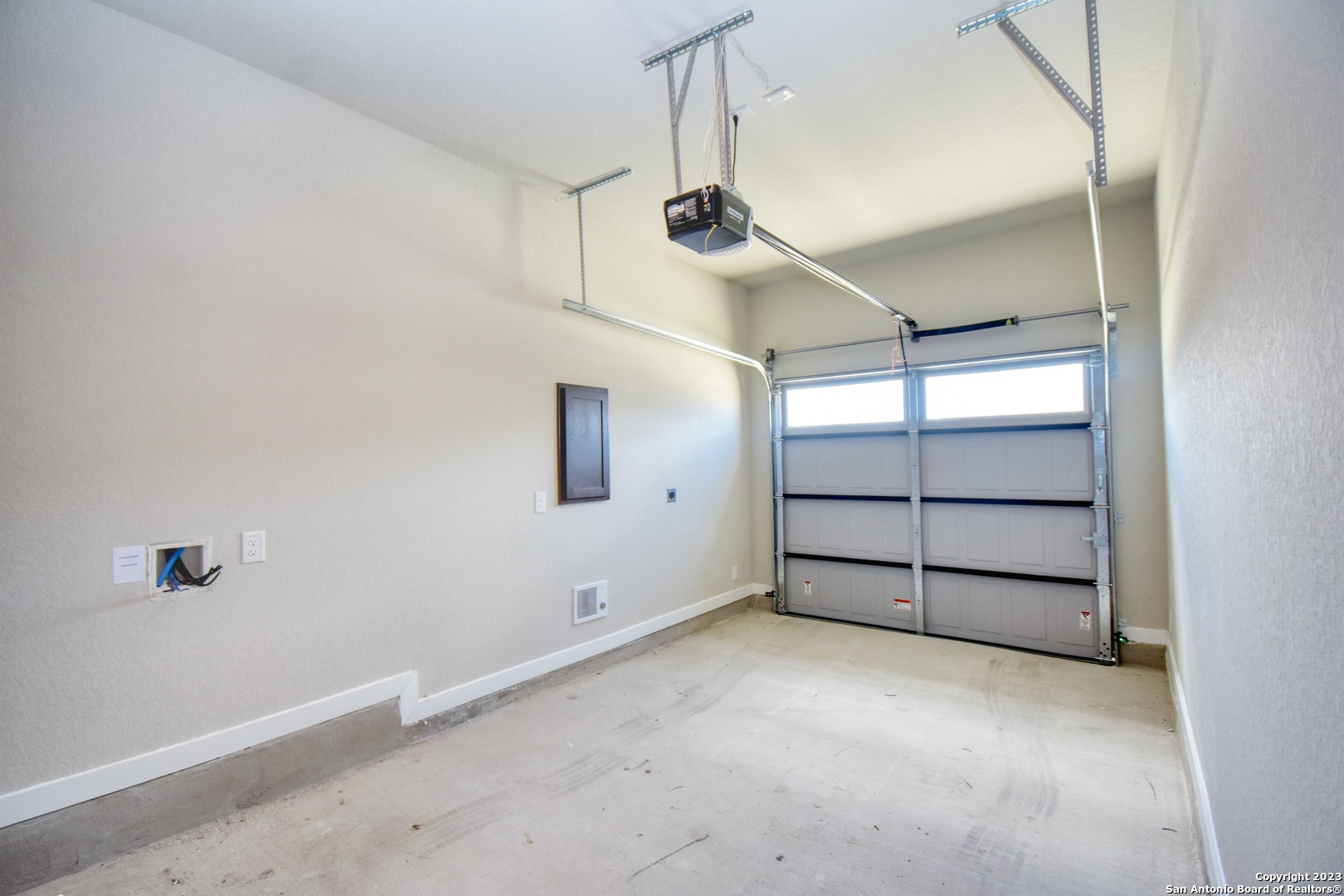 8318 Via Verona, Unit 103 San Antonio, TX 78227 - Photo 16 of 18 an empty room with a empty space and windows