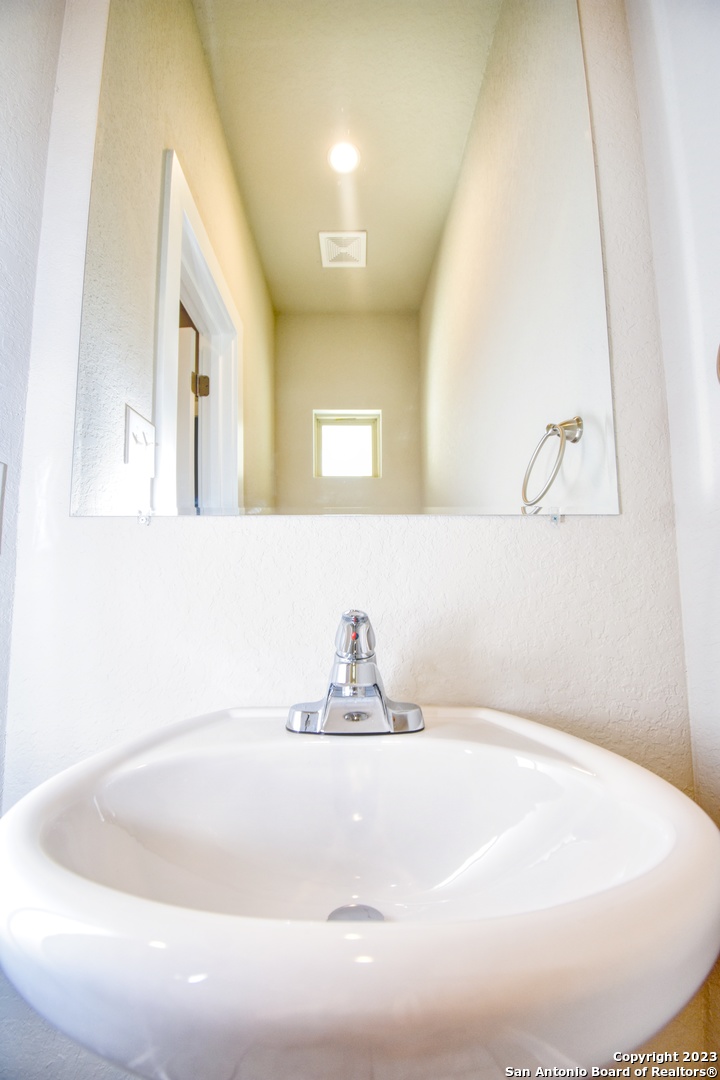 8318 Via Verona, Unit 103 San Antonio, TX 78227 - Photo 6 of 18 a close view of a sink in a bathroom