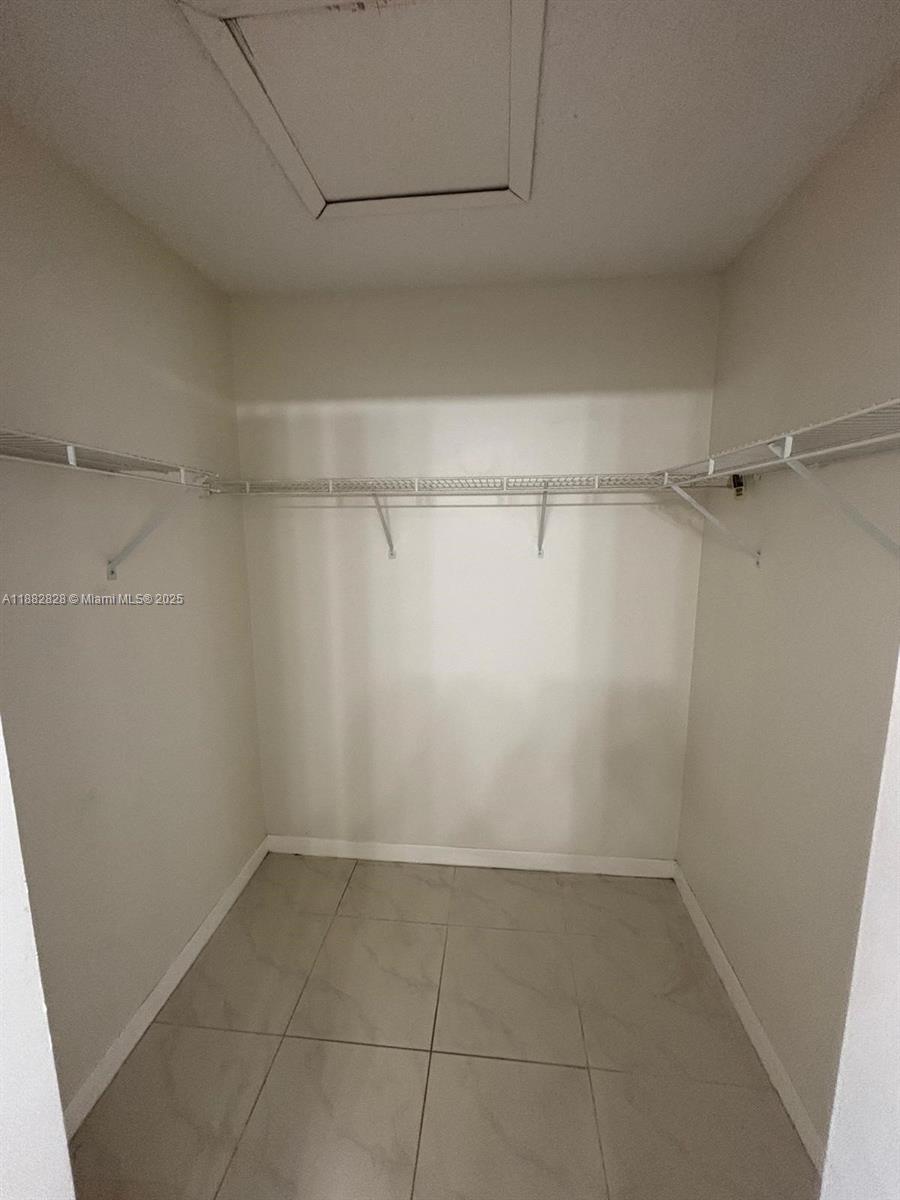 1133 Southeast 13th Terrace Homestead, FL 33035 - Photo 11 of 14 a view of a room with racks on the wall