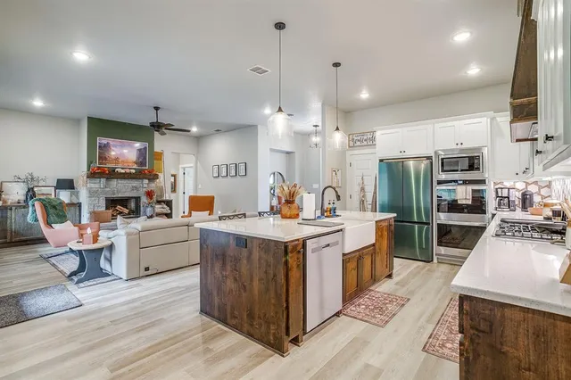 a kitchen that has a lot of cabinets in it