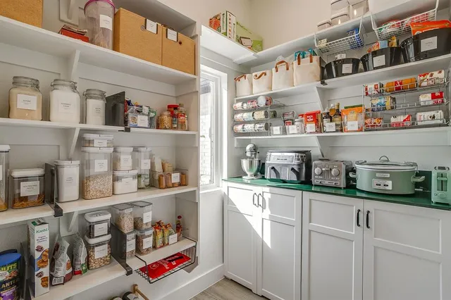 a kitchen with lots of bottles of alcohol