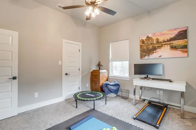 a workspace with furniture and a window