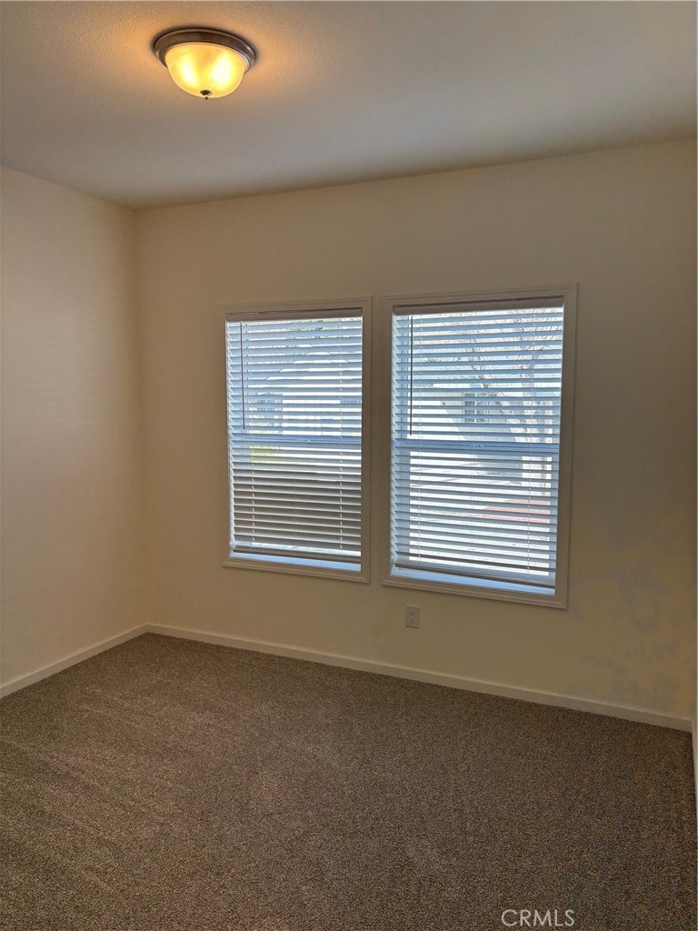 166 Via Robles, Unit 166 Paso Robles, CA 93446 - Photo 23 of 38 Bedroom 2