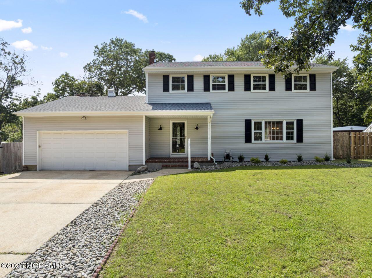 a front view of a house with yard