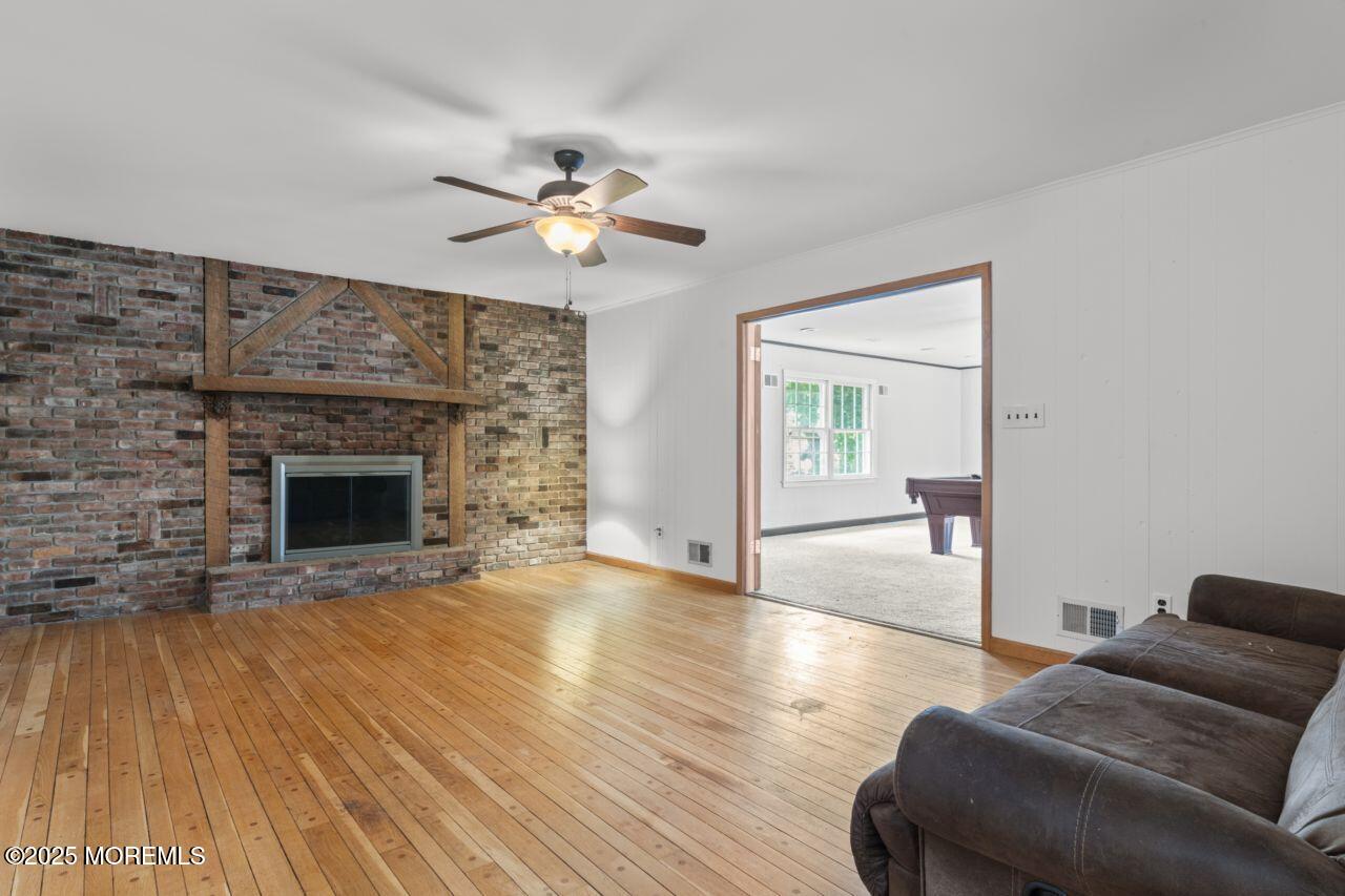 600 Driscol Drive Brick, NJ 08724 - Photo 12 of 35 a living room with furniture and a fireplace