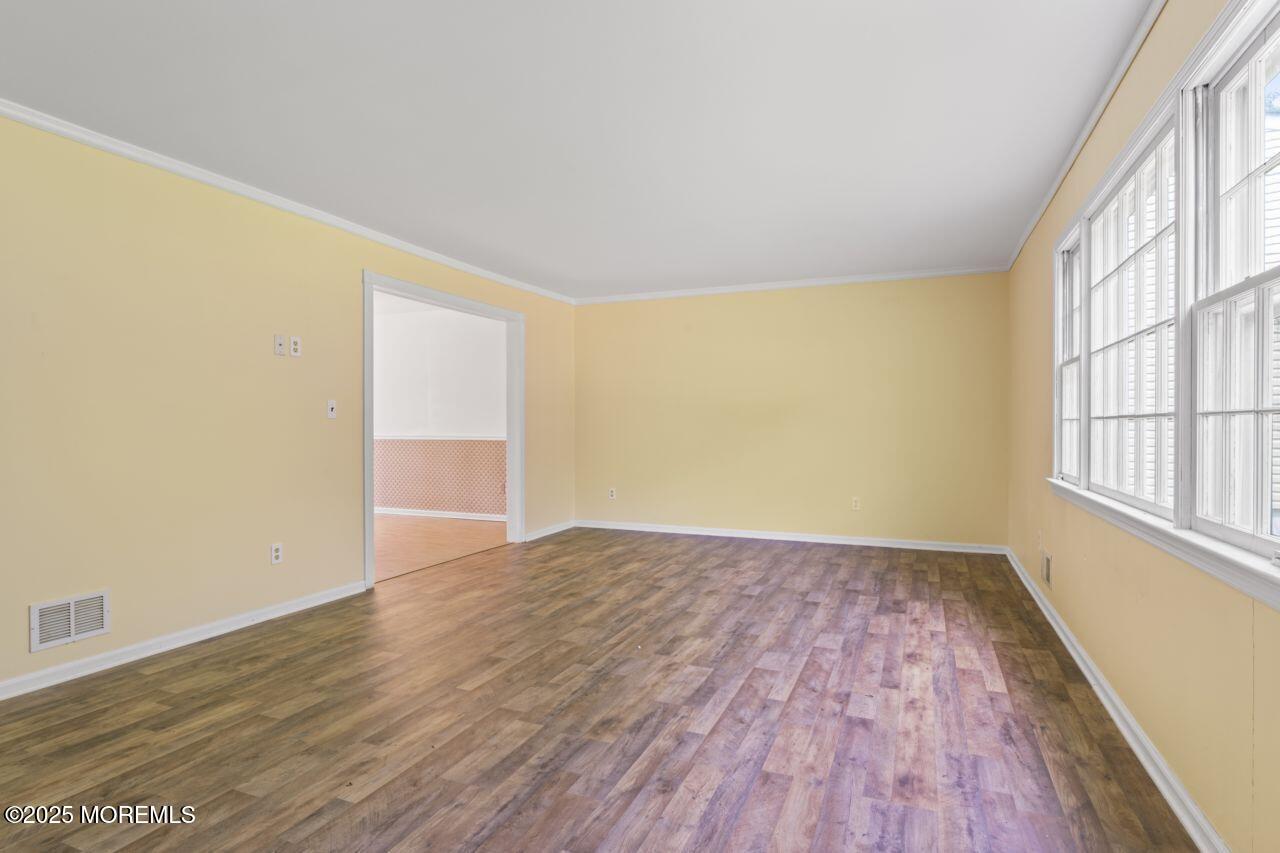 600 Driscol Drive Brick, NJ 08724 - Photo 17 of 35 wooden floor in an empty room with a window