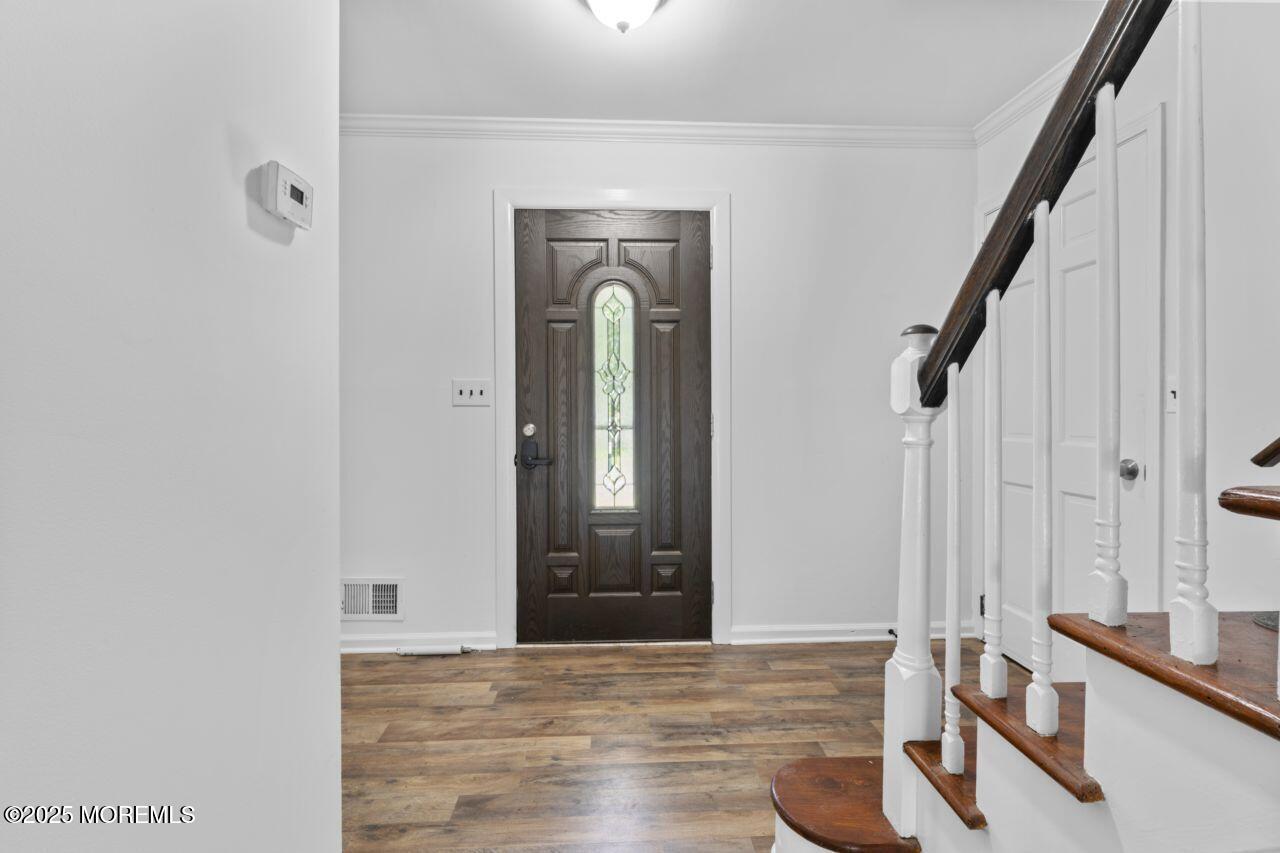 600 Driscol Drive Brick, NJ 08724 - Photo 20 of 35 a view of a hallway with wooden floor and staircase