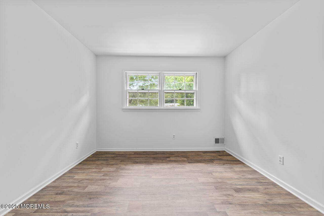 600 Driscol Drive Brick, NJ 08724 - Photo 23 of 35 an empty room with a window