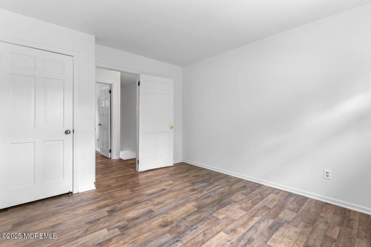600 Driscol Drive Brick, NJ 08724 - Photo 24 of 35 a view of an empty room with wooden floor