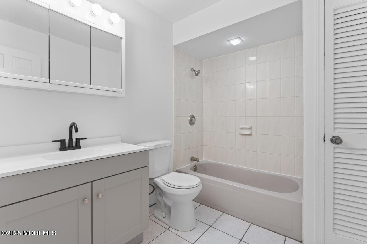 600 Driscol Drive Brick, NJ 08724 - Photo 26 of 35 a bathroom with a sink a toilet and shower