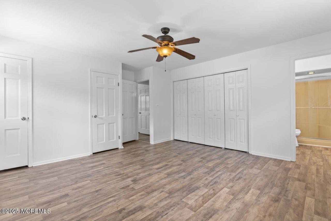 600 Driscol Drive Brick, NJ 08724 - Photo 27 of 35 a view of empty room with wooden floor and ceiling fan