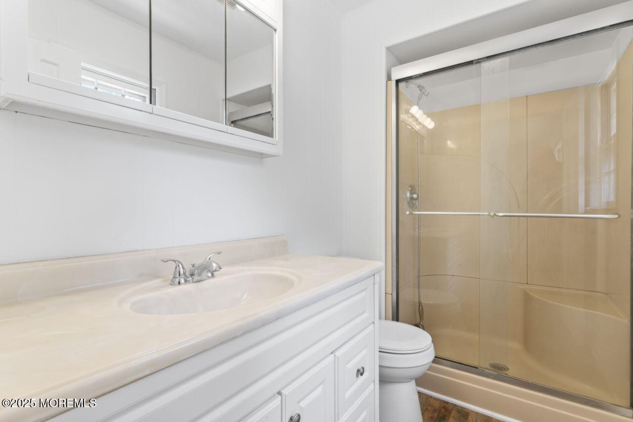 600 Driscol Drive Brick, NJ 08724 - Photo 28 of 35 a bathroom with a sink a toilet and shower