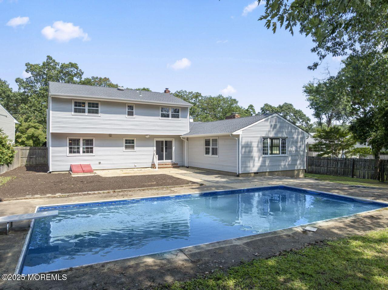 600 Driscol Drive Brick, NJ 08724 - Photo 3 of 35 a front view of a house with a yard