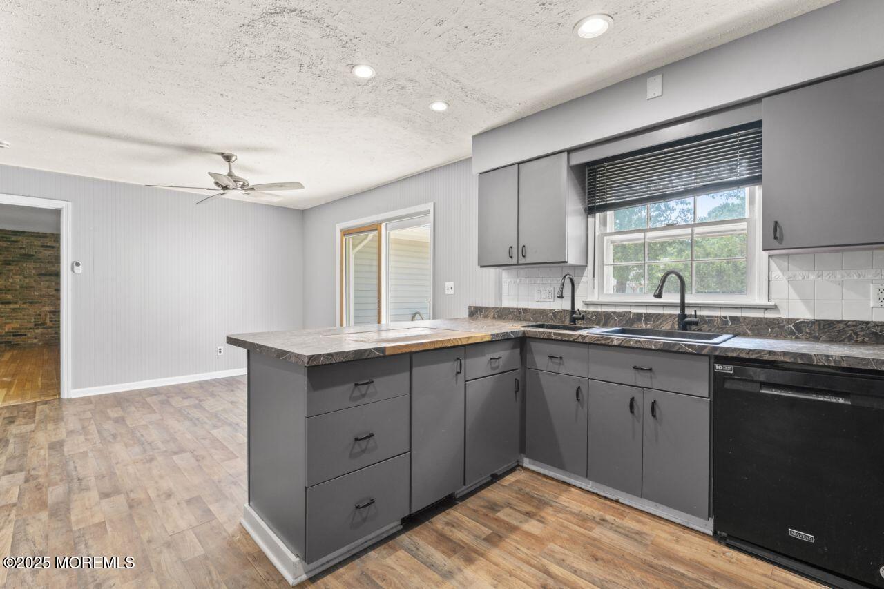 600 Driscol Drive Brick, NJ 08724 - Photo 9 of 35 a kitchen with a sink cabinets and window