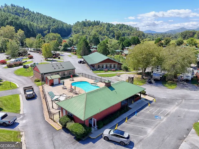 an aerial view of a pool patio swimming pool and outdoor seating