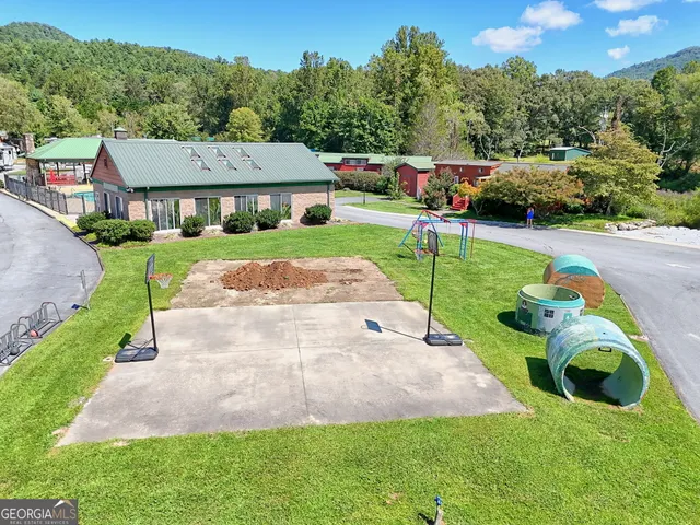 a aerial view of a house with a yard