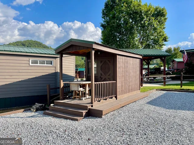swimming pool view with a seating space