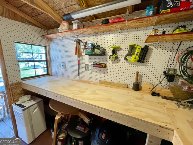 a bathroom with a sink a mirror and next to a window