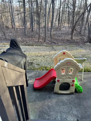 a backyard of a house with barbeque oven