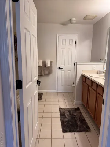 a bathroom with a sink a toilet and a shower