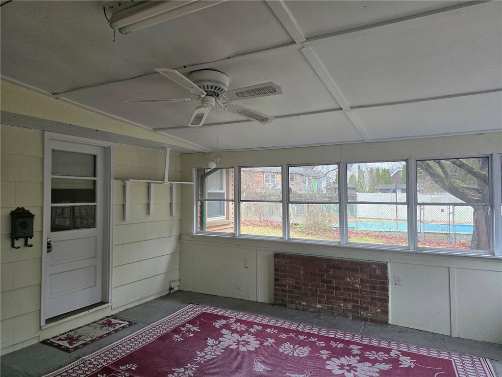 6 Wilder Avenue Westerly, RI 02891 - Photo 19 of 25 Enclosed porch between apartment and house