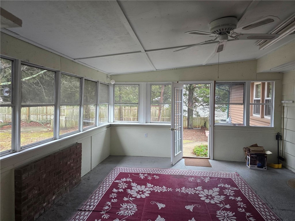 6 Wilder Avenue Westerly, RI 02891 - Photo 20 of 25 nclosed porch between apartment and house