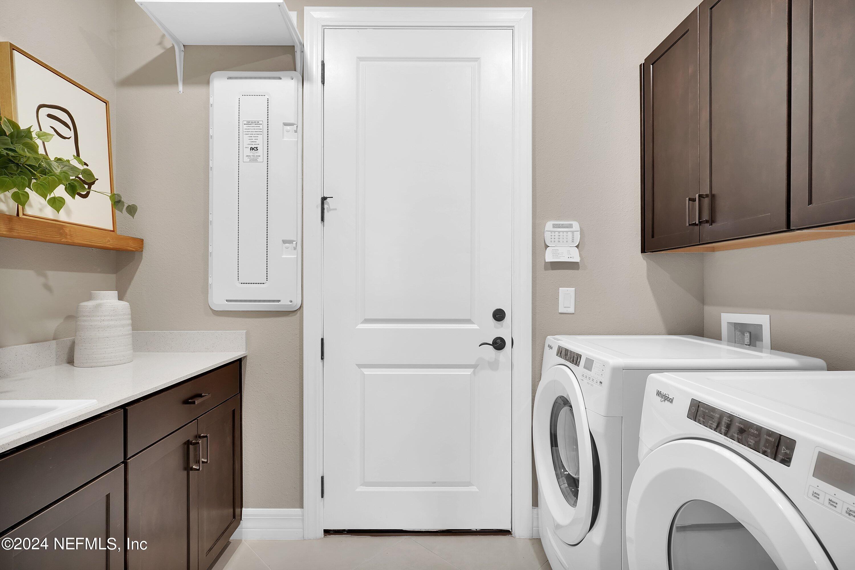 507 Goodwill Court Yulee, FL 32097 - Photo 9 of 38 a utility room with dryer and washer