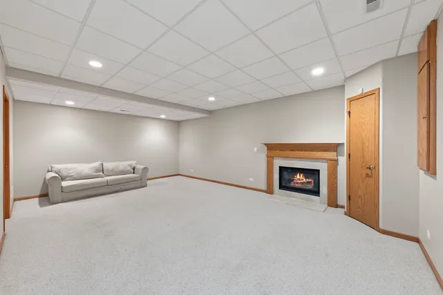 a view of an empty room with a fireplace