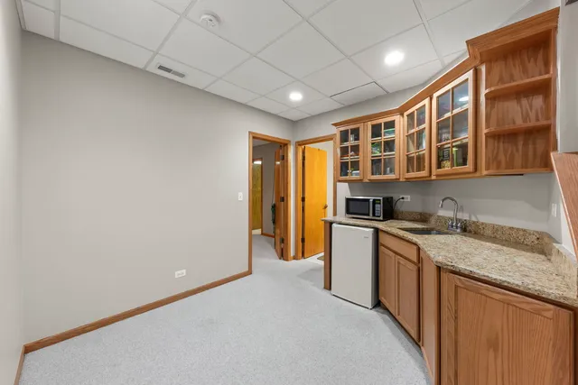 a kitchen with stainless steel appliances granite countertop a sink and cabinets