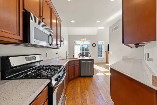 a kitchen with a stove a sink and a refrigerator