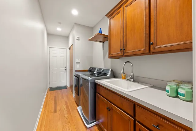 a kitchen with a sink a stove and cabinets