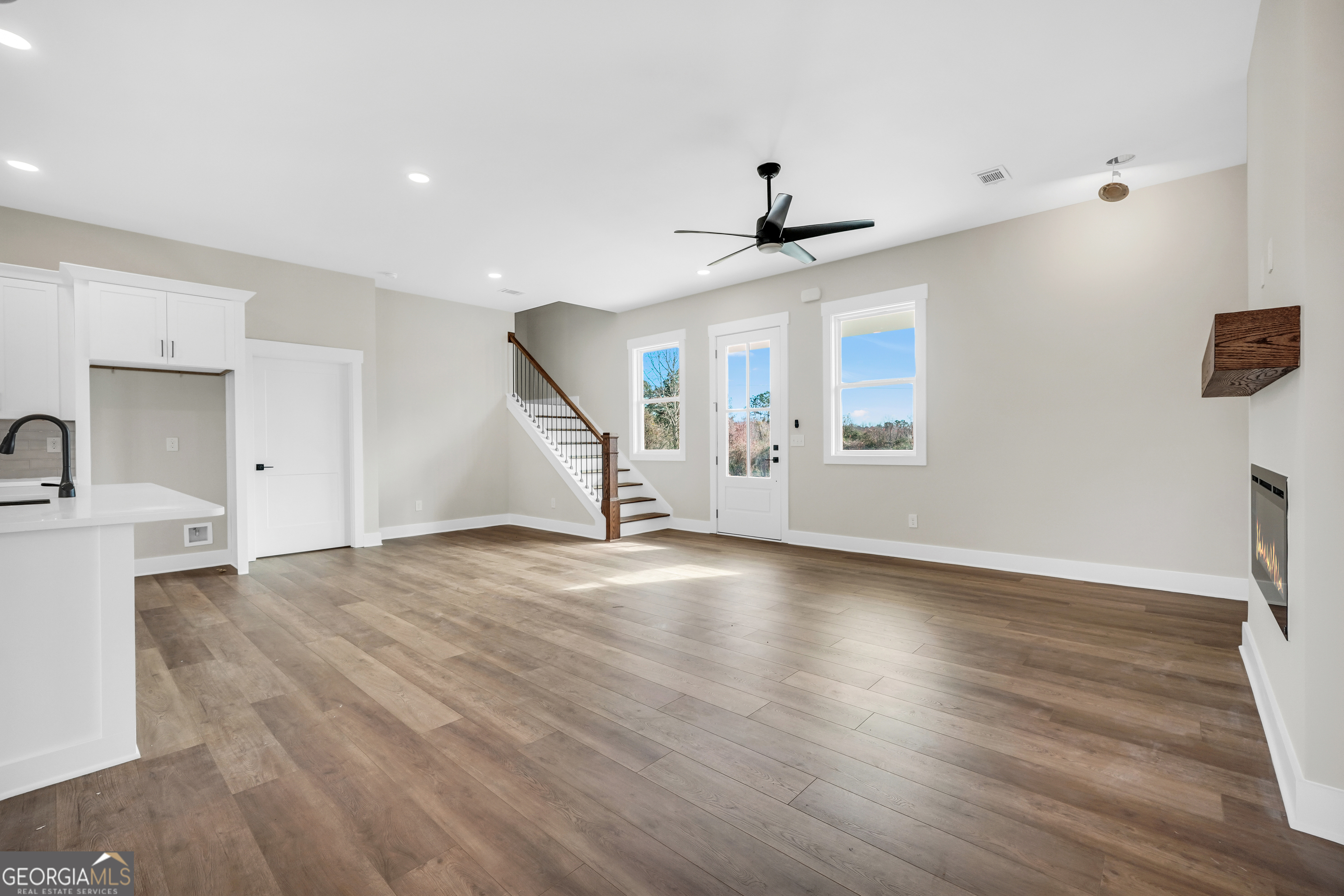 297 East Knight Road McDonough, GA 30252 - Photo 15 of 64 a view of an empty room with window and wooden floor