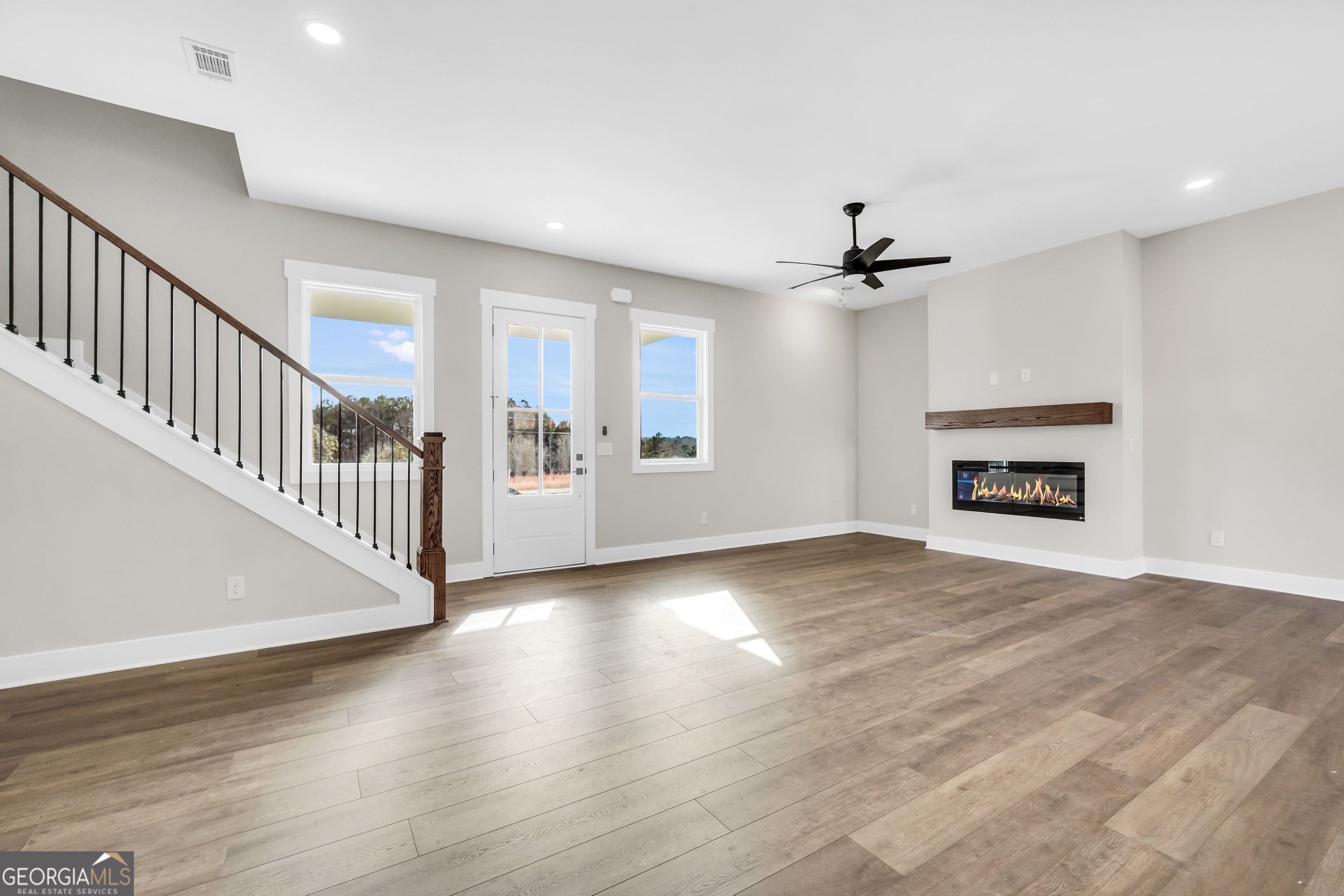 297 East Knight Road McDonough, GA 30252 - Photo 17 of 64 a view of an empty room with a window and a kitchen