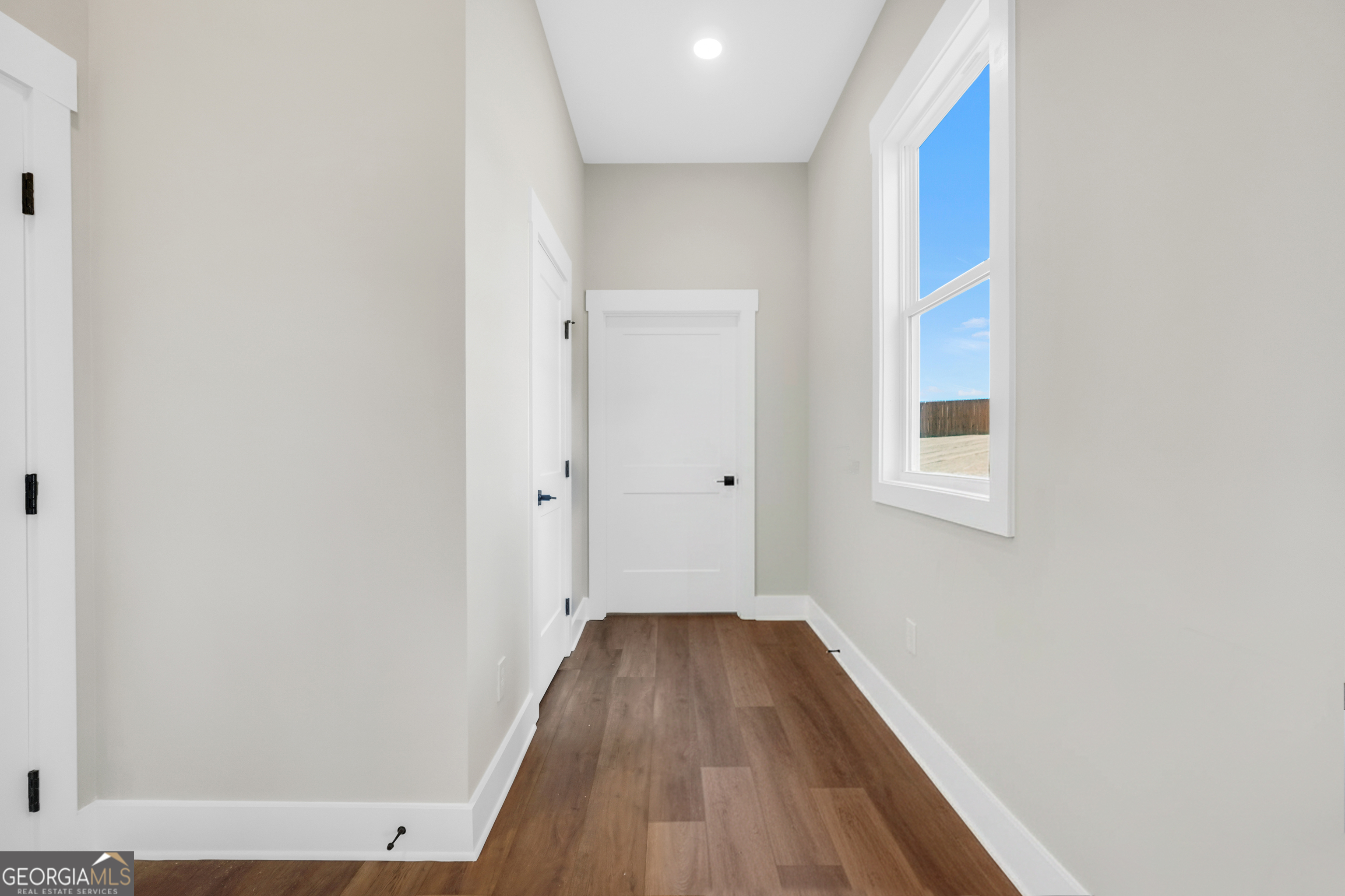 297 East Knight Road McDonough, GA 30252 - Photo 26 of 64 a view of a room with wooden floor and a window