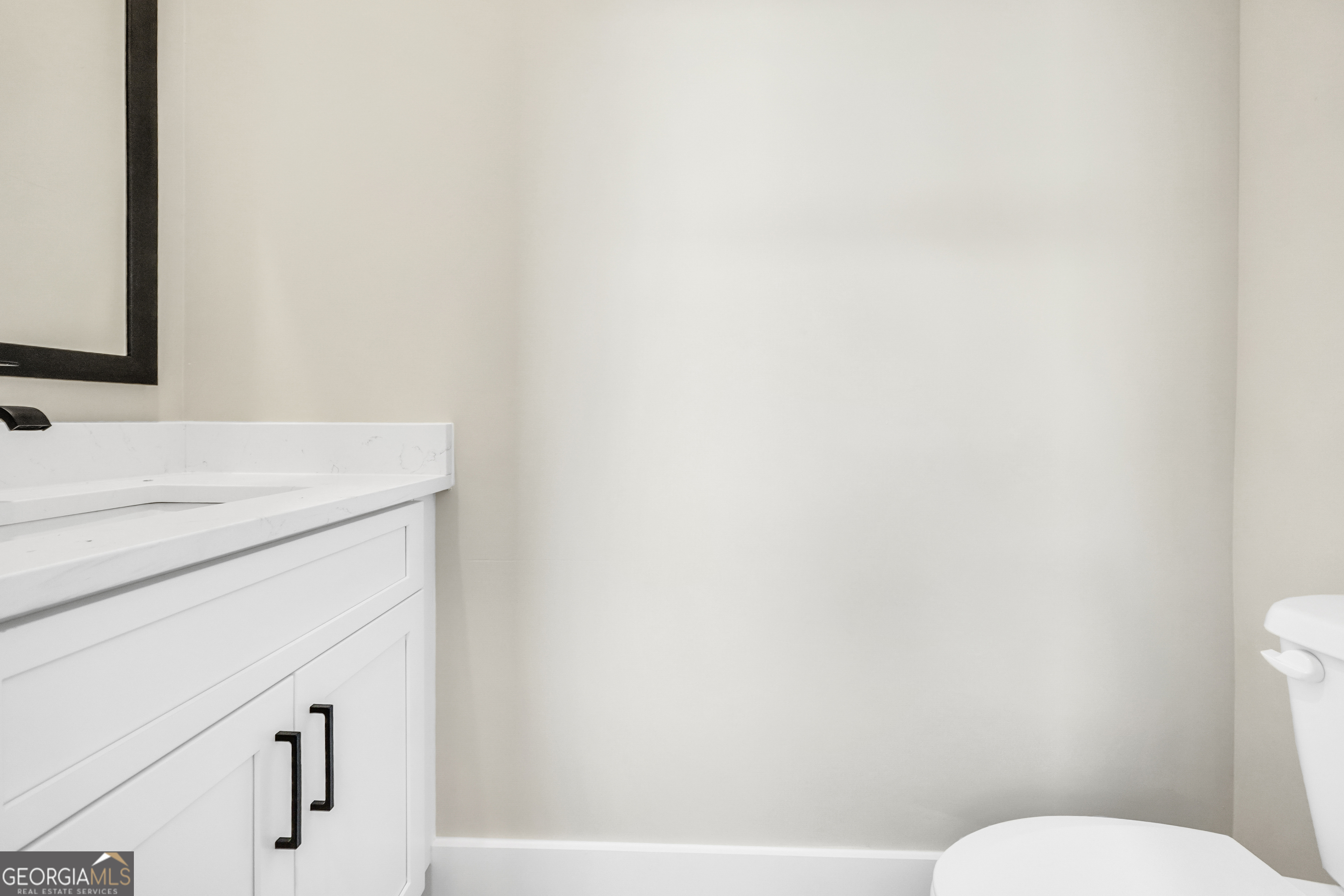 297 East Knight Road McDonough, GA 30252 - Photo 27 of 64 a bathroom with a sink and a toilet